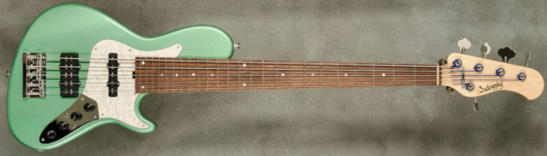 Model 5-24 Single Cut Vintage,
Serial #8864,
Finish Sage Green Metallic,
Body Chambered Alder,
Weight 8.46 lbs,
Neck Maple with thin matte nitro finish,
Radius/Nut 12" radius, 1 3/4" nut width,
Fingerboard Madagascar Rosewood with Mother of Pearl Dots,
Pickguard Vintage Pearl,
Hardware Chrome,
Pickups Sadowsky Humcancelling J/Super J,
Preamp Sadowsky mid-boost preamp with vintage tone control