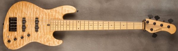 MODEL: 5-21 Standard,
SERIAL: #3455,
FINISH: Natural,
BODY: Swamp Ash with a Quilted Maple Top,
WEIGHT: 9.01 lbs,
NECK: Maple with thin matte nitro finish,
FINGERBOARD: Maple. 12’ radius, 1 3/4” nut width,
PICKGUARD: None,
HARDWARE: Black,
PICKUPS: Sadowsky Humcancelling J in 60's location,
PREAMP: Sadowsky preamp with vintage tone control