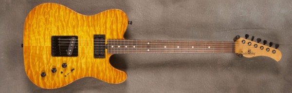 MODEL: Standard T-style,
SERIAL: #5989,
FINISH: Caramel burst,
BODY: Quilted maple on chambered alder,
WEIGHT: 6.90 lbs,
NECK: Roasted maple with thin matte nitro finish,
FINGERBOARD: Brazilian rosewood with 12″ radius, 1 11/16" nut width,
PICKGUARD: None,
HARDWARE: Black,
PICKUPS: Sadowsky tele/humbucker,
PREAMP: Sadowsky preamp with mid and mid/gain boost