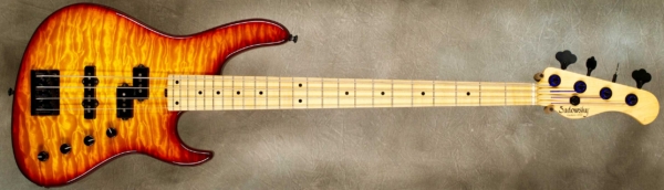 MODEL: 4-24 Standard,
SERIAL: #6148,
FINISH: Cherry Burst,
BODY: Chambered swamp ash with quilt maple top,
WEIGHT: 7.29 lbs,
NECK: Maple with thin matte nitro finish and 12" radius, 1.5" nut width,
FINGERBOARD: Maple,
PICKGUARD: None,
HARDWARE: Black,
PICKUPS: Sadowsky P/J,
PREAMP: Sadowsky preamp with vintage tone control