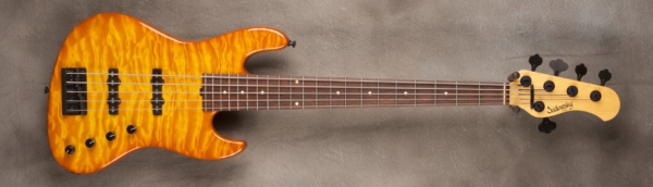 MODEL: 5-21 J-bass,
SERIAL: #6676,
FINISH: Caramel burst,
BODY: Chambered alder,
WEIGHT: 8.36 lbs,
NECK: Maple with thin matte nitro finish,
FINGERBOARD: Amazon rosewood, 12″ radius, 1.75″ nut width,
PICKGUARD: none,
HARDWARE: Black,
PICKUPS: Sadowsky single coil,
PREAMP: Sadowsky preamp with vintage tone control