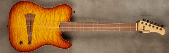 MODEL: Standard Electric Nylon,
SERIAL: #7215,
FINISH: Dark Cherry Burst,
BODY: Chambered Mahogany with Quilt Maple Top,
WEIGHT: 5.51 lbs,
NECK: Maple with thin matte nitro finish,
FINGERBOARD: Morado, 12″ radius, 1.7/8″ nut width,
PICKGUARD: none,
HARDWARE: Black,
PICKUPS: Barbera under-saddle,
PREAMP: Sadowsky buffer preamp