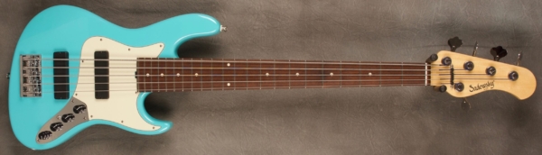 MODEL: 5-22 Will Lee,
SERIAL: #7235,
FINISH: Maui Blue,
BODY: Chambered Alder,
WEIGHT: 8.29 lbs,
NECK: Maple with thin matte nitro finish and 12" radius and 1 7/8 nut width,
FINGERBOARD: Amazon Rosewood,
PICKGUARD: Parchment,
HARDWARE: Chrome,
PICKUPS: Sadowsky Soapbars in 60's Location,
PREAMP: Sadowsky preamp with vintage tone control and mid boost circuit