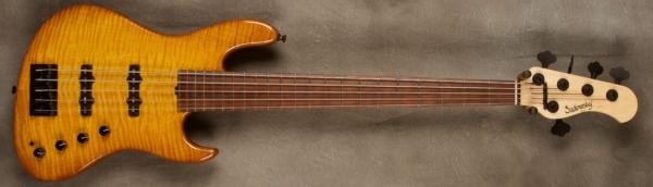 MODEL: 5-22 Will Lee,
SERIAL: #7297,
FINISH: Caramel Burst,
BODY: Chambered Alder with Flame Maple Top,
WEIGHT: 7.99 lbs,
NECK: Maple with thin matte nitro finish and 12" radius and 1 3/4 nut width,
FINGERBOARD: Madagascar Rosewood,
PICKGUARD: None,
HARDWARE: Black,
PICKUPS: Sadowsky Single Coil J Pickups in 60's Location,
PREAMP: Sadowsky preamp with vintage tone control and mid-boost circuit