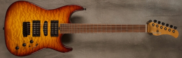 MODEL: Standard S-style,
SERIAL: #7351,
FINISH: Dark cherry burst,
BODY: Quilted maple on chambered alder,
WEIGHT: 6.77 lbs,
NECK: Maple with thin matte nitro finish,
FINGERBOARD: Morado, 12″ radius, 1.625″ nut width,
PICKGUARD: none,
HARDWARE: Black,
PICKUPS: Sadowsky H-S-H,
PREAMP: Sadowsky preamp with mid and mid/gain boost