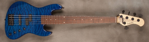 MODEL: 5-21 Standard PJ-bass,
SERIAL: #7358,
FINISH: T-blue,
BODY: Chambered alder,
WEIGHT: 8.30,
NECK: Maple with thin matte nitro finish,
FINGERBOARD: Amazon rosewood, 12″ radius, 1.875″ nut width,
PICKGUARD: none,
HARDWARE: Black,
PICKUPS: Sadowsky humcancelling PJ,
PREAMP: Sadowsky preamp with vintage tone control