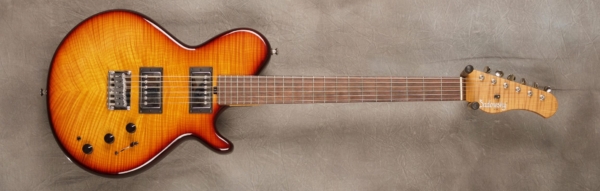 MODEL: Spruce Core SS-13 Broadway,
SERIAL: #7391,
FINISH: Dark cherry burst,
BODY: Flame maple (top and back) on chambered spruce,
WEIGHT: 6.56 lbs,
NECK: Roasted flame maple with thin matte nitro finish,
FINGERBOARD: Brazilian rosewood, 12″ radius, 1.75″ nut width,
PICKGUARD: none,
HARDWARE: Chrome,
PICKUPS: Sadowsky humbuckers,
PREAMP: Sadowsky preamp with mid and mid/gain boost