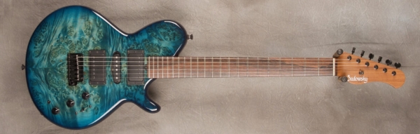 MODEL: Spruce Core LS-13 Broadway,
SERIAL: #7392,
FINISH: Peacock blue burst,
BODY: Burl maple (top and back) on chambered spruce,
WEIGHT: 7.15 lbs,
NECK: Pau ferro with thin matte nitro finish,
FINGERBOARD: Brazilian rosewood, 12″ radius, 1.75″ nut width,
PICKGUARD: none,
HARDWARE: Black,
PICKUPS: Sadowsky H-S-H,
PREAMP: Sadowsky preamp with mid and mid/gain boost