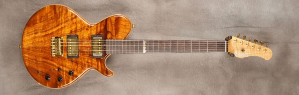 MODEL: Standard SS-13 Broadway,
SERIAL: #7552,
FINISH: Natural,
BODY: Koa (top and back) on chambered spruce,
WEIGHT: 6.42 lbs,
NECK: Roasted flame maple with thin matte nitro finish,
FINGERBOARD: Brazilian rosewood, 12″ radius, 1 11/16″ nut width,
PICKGUARD: none,
HARDWARE: Gold,
PICKUPS: Sadowsky humbuckers,
PREAMP: Sadowsky preamp with mid and mid/gain boost