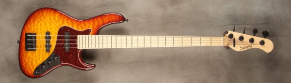 MODEL: 4-24 Vintage J-bass,
SERIAL: #7593,
FINISH: Dark cherry burst,
BODY: Chambered swamp ash with Quilted Maple Top,
WEIGHT: 8.34 lbs,
NECK: Maple with thin matte nitro finish,
FINGERBOARD: Maple, 12″ radius, 1.5″ nut width,
PICKGUARD: Tortoise shell,
HARDWARE: Black,
PICKUPS: Sadowsky humcancelling,
PREAMP: Sadowsky preamp with vintage tone control