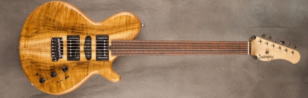 MODEL: LS-13 Broadway Guitar,
SERIAL: #7648,
FINISH: Natural,
BODY: Chambered Alder with Myrtle Top,
WEIGHT: 6.48 lbs,
NECK: Maple with thin matte nitro finish w/vintage tuners,
FINGERBOARD: Madagascar Rosewood 12" radius, 1 3/4” nut width,
PICKGUARD: none,
HARDWARE: Chrome with Tremolo Bridge,
PICKUPS: HSH,
PREAMP: Sadowsky preamp with vintage tone control