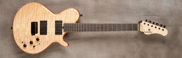 MODEL: Standard SS-13 Broadway,
SERIAL: #7650,
FINISH: Natural,
BODY: Flame maple on chambered okoume,
WEIGHT: 6.81 lbs,
NECK: Maple with thin matte nitro finish,
FINGERBOARD: Ebony, 12″ radius, 1.75″ nut width,
PICKGUARD: none,
HARDWARE: Black,
PICKUPS: Sadowsky humbuckers,
PREAMP: Sadowsky preamp with mid and mid/gain boost