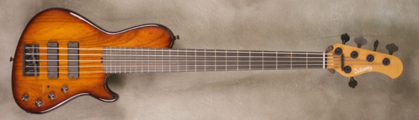 MODEL: 5-24 Standard Single Cut,
SERIAL: #7652,
FINISH: 59 burst,
BODY: Chambered roasted alder,
WEIGHT: 8.06 lbs,
NECK: Roasted maple with thin matte nitro finish,
FINGERBOARD: Ebony, 12″ radius, 1.75″ nut width,
PICKGUARD: None,
HARDWARE: Black,
PICKUPS: Sadowsky soapbars in modern locations,
PREAMP: Sadowsky preamp with switchable mid-boost