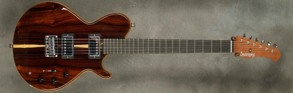 MODEL: Cedar Core SS-13 Guitar,
SERIAL: #7662,
FINISH: Natural,
BODY: Cedar core with matching master grade Cocobolo top and back,
WEIGHT: 6.10 lbs,
NECK: Honduras Mahogany with thin matte nitro finish,
FINGERBOARD: Ebony, 12″ radius, 1 11/16″ nut width,
PICKGUARD: none,
HARDWARE: Chrome,
PICKUPS: Sadowsky custom wound PAF pickups,
PREAMP: Sadowsky preamp mid boost preamp