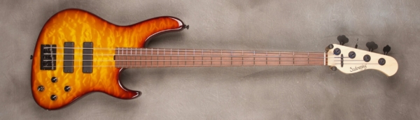 MODEL: 4-24 Modern,
SERIAL: #7865,
FINISH: Dark cherry burst,
BODY: Chambered alder with Quilt Maple Top,
WEIGHT: 7.23,
NECK: Maple with thin matte nitro finish,
FINGERBOARD: Madagascar Rosewood, 12″ radius, 1.5″ nut width,
PICKGUARD: None,
HARDWARE: Black,
PICKUPS: Sadowsky soapbar,
PREAMP: Sadowsky preamp with vintage tone control
