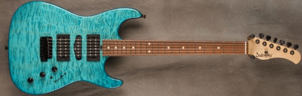 MODEL: Standard S-style,
SERIAL: #7947,
FINISH: Oahu Blue,
BODY: Quilted maple on chambered alder,
WEIGHT: 6.86 lbs,
NECK: Maple with thin matte nitro finish,
FINGERBOARD: Morado, 12″ radius, 1 5/8″ nut width,
PICKGUARD: none,
HARDWARE: Black,
PICKUPS: Sadowsky H-S-H,
PREAMP: Sadowsky preamp with mid and mid/gain boost