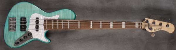 MODEL: 5-24 Vintage Single Cut,
SERIAL: #8056,
FINISH: T-Aqua,
BODY: Chambered alder,
WEIGHT: 8.10 lbs,
NECK: Maple with thin matte nitro finish,
FINGERBOARD: Morado,
PICKGUARD: White Pearloid,
HARDWARE: Chrome,
PICKUPS: Sadowsky single J-style pickup in the neck position and dual-coil 60/70 pickup in the bridge positionJ/Super J,
PREAMP: Mid Boost Pre-amp with switchable mid boost and trim pot