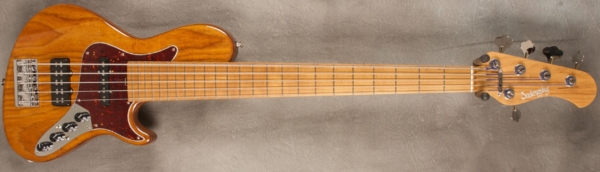 MODEL: 5-24 Single Cut 5-String Bass,
SERIAL: #8105,
FINISH: Natural,
BODY: Chambered Roasted Swamp Ash with Accent Line,
WEIGHT: 8.61 lbs,
NECK: Roasted Maple with thin matte nitro finish,
FINGERBOARD: Roasted Maple 12" radius, 1 7/8” nut width,
PICKGUARD: Tortoise,
HARDWARE: Chrome,
PICKUPS: Sadowsky Humcancelling J/Super J pickup (with 60's/70's/both switching),
PREAMP: Sadowsky mid-boost preamp with vintage tone control
