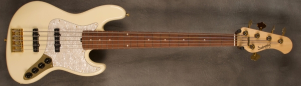 MODEL: 5-20 Vintage J-bass,
SERIAL: #8126,
FINISH: Olympic White,
BODY: Chambered Alder,
WEIGHT: 8.97 lbs,
NECK: Maple with thin matte nitro finish,
FINGERBOARD: Madagascar Rosewood 12’ radius, 1 7/8” nut width,
PICKGUARD: Vintage Pearl,
HARDWARE: Gold,
PICKUPS: Sadowsky Single Coil JJ in 60's locations,
PREAMP: Sadowsky preamp with vintage tone control