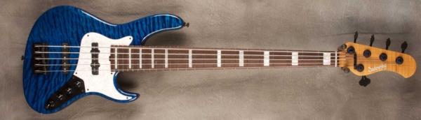 MODEL: 5-24 Vintage J-bass,
SERIAL: #8148,
FINISH: T-blue,
BODY: Quilted maple on chambered okoume,
WEIGHT: 8.74,
NECK: Roasted flame maple with thin matte nitro finish,
FINGERBOARD: Amazon rosewood with pearloid blocks, 12″ radius, 1.75″ nut width,
PICKGUARD: White pearloid,
HARDWARE: Black,
PICKUPS: Sadowsky humcancelling J pickups,
PREAMP: Sadowsky preamp with vintage tone control