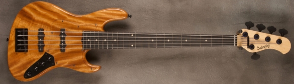 MODEL: 5-22 Vintage Will Lee,
SERIAL: #8188,
FINISH: Natural,
BODY: Chambered Alder w/Monkeypod top,
WEIGHT: 8.4 lbs,
NECK: Maple with thin matte nitro finish,
FINGERBOARD: Ebony, 12″ radius, 1.75″ nut width,
PICKGUARD: Plexi,
HARDWARE: Black,
PICKUPS: Sadowsky single coil, 60's location JJ,
PREAMP: Sadowsky preamp with vintage tone control and mid boost circuit