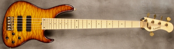 MODEL: 5-24 Modern,
SERIAL: #8243,
FINISH: Dark Cherry Burst,
BODY: Chambered Ash with Quilted Maple Top,
WEIGHT: 8.24 lbs,
NECK: Maple with thin matte nitro finish,
FINGERBOARD: Maple 12’ radius, 1 7/8” nut width,
PICKGUARD: None,
HARDWARE: Gold hardware,
PICKUPS: Sadowsky Soapbars in modern locations,
PREAMP: Sadowsky preamp with vintage tone control