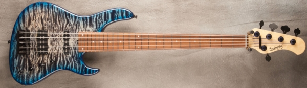 MODEL: 5-24 Standard,
SERIAL: #8255,
FINISH: T-Whale Blue Burst (glossy finish),
BODY: Chambered Alder with a Master Grade Quilted Maple Top,
WEIGHT: 8.5,
NECK: Maple with thin matte nitro finish,
FINGERBOARD: Morado, 12″ radius, 1.875″ nut width with Abalone Dots,
PICKGUARD: None,
HARDWARE: Black,
PICKUPS: Sadowsky Humcancelling J/Super J,
PREAMP: Sadowsky preamp with vintage tone control