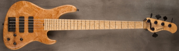 MODEL: 5-24 Modern,
SERIAL: #8263,
FINISH: Natural (glossy finish),
BODY: Chambered swamp ash with a Maple Burl Top,
WEIGHT: 8.02,
NECK: Maple with thin matte nitro finish,
FINGERBOARD: Birdseye Maple, 12″ radius, 1.875″ nut width,
PICKGUARD: None,
HARDWARE: Black,
PICKUPS: Sadowsky soapbar in modern locations,
PREAMP: Sadowsky preamp with vintage tone control