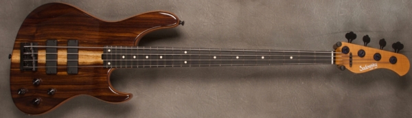 MODEL: 4-24 Modern,
SERIAL: #8276,
FINISH: Natural,
BODY: Chambered Okume (African Mahogany) with an East Indian Rosewood top,
WEIGHT: 7.36,
NECK: Roasted Maple with thin matte nitro finish,
FINGERBOARD: Ebony, 12″ radius, 1.5″ nut width,
PICKGUARD: None,
HARDWARE: Black,
PICKUPS: Sadowsky soapbar in modern locations,
PREAMP: Sadowsky preamp with vintage tone control