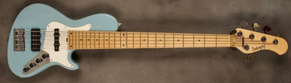MODEL 5-24 Single Cut 5-String Bass
SERIAL #8286
FINISH Transparent-Sonic Blue
BODY Chambered Swamp Ash
WEIGHT 8.23 lbs
NECK Maple with thin matte nitro finish with matching headstock
FINGERBOARD Maple 12″ radius, 1 7/8” nut width
PICKGUARD Parchment
HARDWARE Chrome
PICKUPS Sadowsky hum cancelling J and Super J
PREAMP Sadowsky mid-boost preamp with vintage tone control