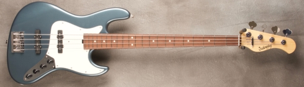 MODEL: 4-21 Vintage J-bass,
SERIAL: #8290,
FINISH: Vintage Teal Green Metallic (glossy finish),
BODY: Chambered Alder,
WEIGHT: 7.90 lbs,
NECK: Maple with thin matte nitro finish,
FINGERBOARD: Amazon Rosewood. 12’ radius, 1.5” nut width,
PICKGUARD: White,
HARDWARE: Chrome,
PICKUPS: Sadowsky Hum Cancelling, 60’s Location,
PREAMP: Sadowsky preamp with vintage tone control