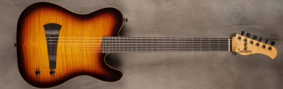 MODEL: Standard Electric Nylon,
SERIAL: #8297,
FINISH: 59' burst,
BODY: Chambered alder,
WEIGHT: 6.47 lbs,
NECK: Maple with thin matte nitro finish,
FINGERBOARD: Ebony, 12″ radius, 1 7/8″ nut width,
PICKGUARD: none,
HARDWARE: Black,
PICKUPS: Barbera under-saddle,
PREAMP: Sadowsky buffer preamp