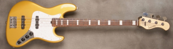 MODEL: 4-20 Vintage J-bass,
SERIAL: #8300,
FINISH: Shoreline Gold (glossy finish),
BODY: Chambered Alder,
WEIGHT: 8.38 lbs,
NECK: Maple with thin matte nitro finish,
FINGERBOARD: Amazon Rosewood. 12’ radius, 1.5” nut width White Pearl Blocks,
PICKGUARD: Pearl,
HARDWARE: Chrome,
PICKUPS: Sadowsky Single Coil, 60’s Location,
PREAMP: Sadowsky preamp with vintage tone control Vol/Vol/T/T-B Control Setup
