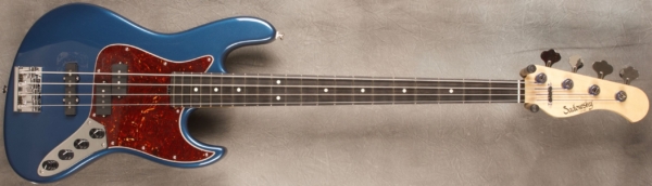 MODEL: 4-21 Vintage J-bass,
SERIAL: #8313,
FINISH: Dark Lake Placid Blue,
BODY: Chambered Alder,
WEIGHT: 7.84 lbs,
NECK: Maple with thin matte nitro finish,
FINGERBOARD: Ebony. 12" radius, 1.5” nut width,
PICKGUARD: Tortoise,
HARDWARE: Chrome,
PICKUPS: Sadowsky P/J,
PREAMP: Sadowsky preamp with vintage tone control