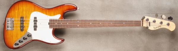 MODEL: 4-21 Vintage J-bass,
SERIAL: #8326,
FINISH: Dark Cherry Burst,
BODY: Chambered Alder,
WEIGHT: 7.81 lbs,
NECK: Maple with thin matte nitro finish,
FINGERBOARD: Madagascar Rosewood with Abalone dots. 12" radius, 1.5” nut width,
PICKGUARD: Parchment,
HARDWARE: Chrome,
PICKUPS: Sadowsky Humcancelling, 60’s Location,
PREAMP: Sadowsky preamp with vintage tone control