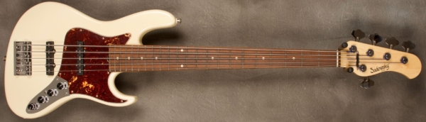 MODEL: 5-22 Will Lee,
SERIAL: #8374,
FINISH: Olympic White,
BODY: Chambered Alder,
WEIGHT: 8.49 lbs,
NECK: Maple with thin matte nitro finish and 12" radius and 1 3/4" nut width,
FINGERBOARD: Morado,
PICKGUARD: Tortoise,
HARDWARE: Chrome,
PICKUPS: Sadowsky JJ single coils in 60's Location,
PREAMP: Sadowsky preamp with vintage tone control and mid boost circuit