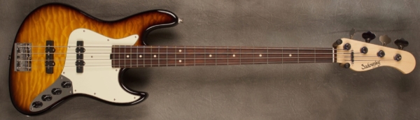 MODEL: 4-21 Vintage J-bass,
SERIAL: #8401,
FINISH: 59' Burst,
BODY: Chambered Alder with quilted Maple top,
WEIGHT: 7.84 lbs,
NECK: Maple with thin matte nitro finish,
FINGERBOARD: Amazon Rosewood. 12’ radius, 1.5” nut width,
PICKGUARD: Parchment,
HARDWARE: Chrome,
PICKUPS: Sadowsky Humcancelling, 60’s Location,
PREAMP: Sadowsky preamp with vintage tone control