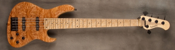 MODEL: 5-24,
SERIAL: #8452,
FINISH: Natural,
BODY: Chambered Ash with Master Grade Burl Maple Top,
WEIGHT: 8.10 lbs,
NECK: Maple neck with thin matte nitro finish,
FINGERBOARD: Birdseye Maple 12’ radius, 1 7/8” nut width,
PICKGUARD: None,
HARDWARE: Black,
PICKUPS: Sadowsky humcancelling J Pickups in 70's in locations,
PREAMP: Sadowsky preamp with vintage tone control