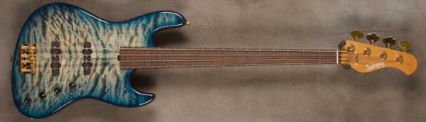 MODEL: 4-21 Standard J-bass,
SERIAL: #8461,
FINISH: Peacock blue (glossy finish),
BODY: Chambered alder with Quilted Maple Top,
WEIGHT: 7.52 lbs,
NECK: Roasted Maple with thin matte nitro finish,
FINGERBOARD: Amazon Rosewood 12’ radius, 1.5” nut width ,
PICKGUARD: None,
HARDWARE: Gold,
PICKUPS: Sadowsky Humcancelling JJ, 60’s Location,
PREAMP: Sadowsky preamp with vintage tone control