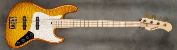 MODEL: 4-20 Vintage,
SERIAL: #8601,
FINISH: Caramel Burst,
BODY: Chambered Alder with Quilt Maple Top,
WEIGHT: 8.40 lbs,
NECK: Maple with thin matte nitro finish and 12" radius, 1.45" nut width,
FINGERBOARD: Birdseye Maple with Pearloid Blocks,
PICKGUARD: Pearloid,
HARDWARE: Gold,
PICKUPS: Sadowsky JJ in 60's Locations,
PREAMP: Sadowsky preamp with vintage tone control