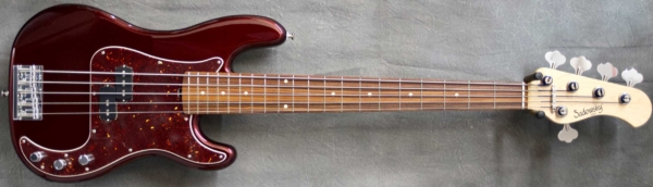 MODEL: 5-20 P Vintage,
SERIAL: #8621,
FINISH: Dark Cherry Metallic,
BODY: Chambered Alder,
WEIGHT: 7.99 lbs,
NECK: Maple with thin matte nitro finish and 12" radius, 1 7/8" nut width,
FINGERBOARD: Morado,
PICKGUARD: Tortoise,
HARDWARE: Chrome,
PICKUPS: Sadowsky P,
PREAMP: Sadowsky preamp with vintage tone control