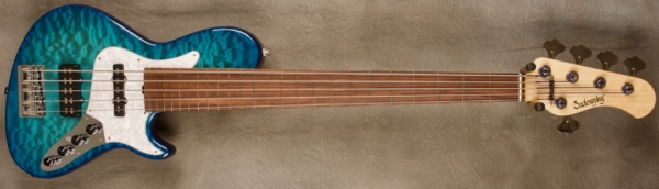 MODEL: 5-24 Single Cut 5-String Bass Standard,
SERIAL: #8624,
FINISH: Bora Blue Burst,
BODY: Chambered Alder with Quilted Maple Top,
WEIGHT: 8.02 lbs,
NECK: Maple with thin matte nitro finish,
FINGERBOARD: Morado 12" radius, 1 7/8” nut width with no fret marker,
PICKGUARD: None,
HARDWARE: Chrome,
PICKUPS: Sadowsky hum cancelling J and Super J,
PREAMP: Sadowsky mid-boost preamp with vintage tone control