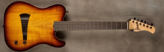 MODEL: Standard Electric Nylon,
SERIAL: #8649,
FINISH: 59' Burst,
BODY: Chambered Okoume with Spalted Maple Top,
WEIGHT: 5.75 lbs,
NECK: Maple with thin matte nitro finish,
FINGERBOARD: Ebony, 12″ radius, 1 7/8″ nut width,
PICKGUARD: none,
HARDWARE: Gold,
PICKUPS: Barbera under-saddle,
PREAMP: Sadowsky buffer preamp