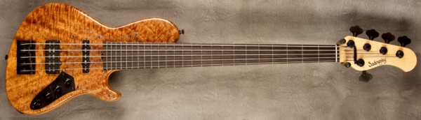 MODEL: 5-24 Single Cut 5-24 Vintage,
SERIAL: #8663,
FINISH: Natural,
BODY: Chambered Spruce Core with Mango top and back,
WEIGHT: 9.04 lbs,
NECK: Maple with thin matte nitro finish,
FINGERBOARD: Ebony 12" radius, 1 7/8” nut width,
PICKGUARD: Clear,
HARDWARE: Black,
PICKUPS: Sadowsky Hum Cancelling J and Super J,
PREAMP: Sadowsky mid-boost preamp with vintage tone control