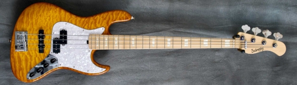 MODEL: 4-20 P/J Vintage,
SERIAL: #8686,
FINISH: Caramel Burst Transparent,
BODY: Swamp Ash with Quilted Maple Top,
WEIGHT: 7.79 lbs,
NECK: Maple with thin matte nitro finish and 12" radius, 1.5" nut width,
FINGERBOARD: Maple with white pearloid blocks,
PICKGUARD: White pearloid,
HARDWARE: Chrome,
PICKUPS: Sadowsky P/J set,
PREAMP: Sadowsky preamp with vintage tone control and mid boost circuit