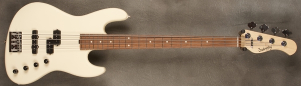 MODEL: Satin Series Verdine White 4,
SERIAL: #8773,
FINISH: Olympic White,
BODY: Chambered alder,
WEIGHT: 7.41,
NECK: Maple with thin matte nitro finish,
FINGERBOARD: Morado, 12″ radius, 1.5″ nut width,
PICKGUARD: None,
HARDWARE: Chrome,
PICKUPS: Sadowsky humcancelling P/J,
PREAMP: Sadowsky preamp with vintage tone control