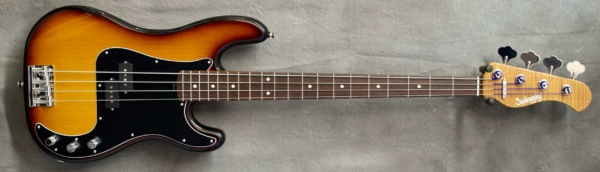 MODEL: 4-20 Vintage,
SERIAL: #8877,
FINISH: '59 Burst,
BODY: Chambered alder,
WEIGHT: 7.69 lbs,
NECK: Roasted Flame Maple with thin matte nitro finish and 9" radius, 1.5" nut width,
FINGERBOARD: Amazon Rosewood,
PICKGUARD: Matte B/W/B,
HARDWARE: Chrome,
PICKUPS: Sadowsky P (only),
PREAMP: Sadowsky preamp with vintage tone control