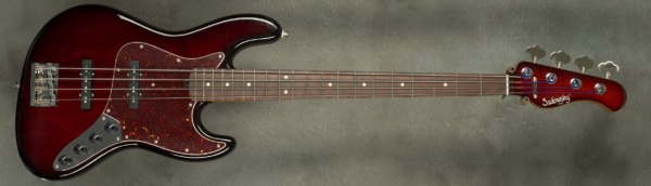 MODEL: 4-20 Vintage,
SERIAL: #8899,
FINISH: Burgundy Burst w/ matching burst headstock,
BODY: Chambered Roasted Alder,
WEIGHT: 8.29 lbs,
NECK: Roasted Maple with thin matte nitro finish and 9" radius, 1.5" nut width,
FINGERBOARD: Amazon Rosewood,
PICKGUARD: Tortoise,
HARDWARE: Chrome,
PICKUPS: Sadowsky Single Coils in 60's Locations,
PREAMP: Sadowsky preamp with vintage tone control