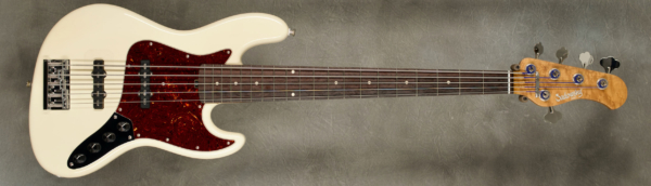 Model 5-20 Vintage,
Serial #8910,
Finish Olympic White,
Body Chambered Alder,
Weight 8.73 lbs,
Neck Roasted Birdseye Maple with thin matte nitro finish,
Radius/Nut 12" radius, 1 3/4" nut width,
Fingerboard Amazon Rosewood,
Pickguard Tortoise,
Hardware Chrome,
Pickups Sadowsky Single Coil J in 60's locations,
Preamp Sadowsky preamp with vintage tone control