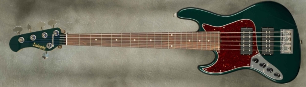 MODEL: 5-21 Vintage,
SERIAL: #8991,
FINISH: Sherwood Green with Matching Headstock,
BODY: Chambered Alder,
WEIGHT: 8.84 lbs,
NECK: Maple with thin matte nitro, finish and 12" radius, 1 3/4" nut width,
FINGERBOARD: Amazon Rosewood,
PICKGUARD: Dark Tortoise,
HARDWARE: Chrome,
PICKUPS: Sadowsky Super P/Super J,
PREAMP: Sadowsky preamp with vintage tone control.